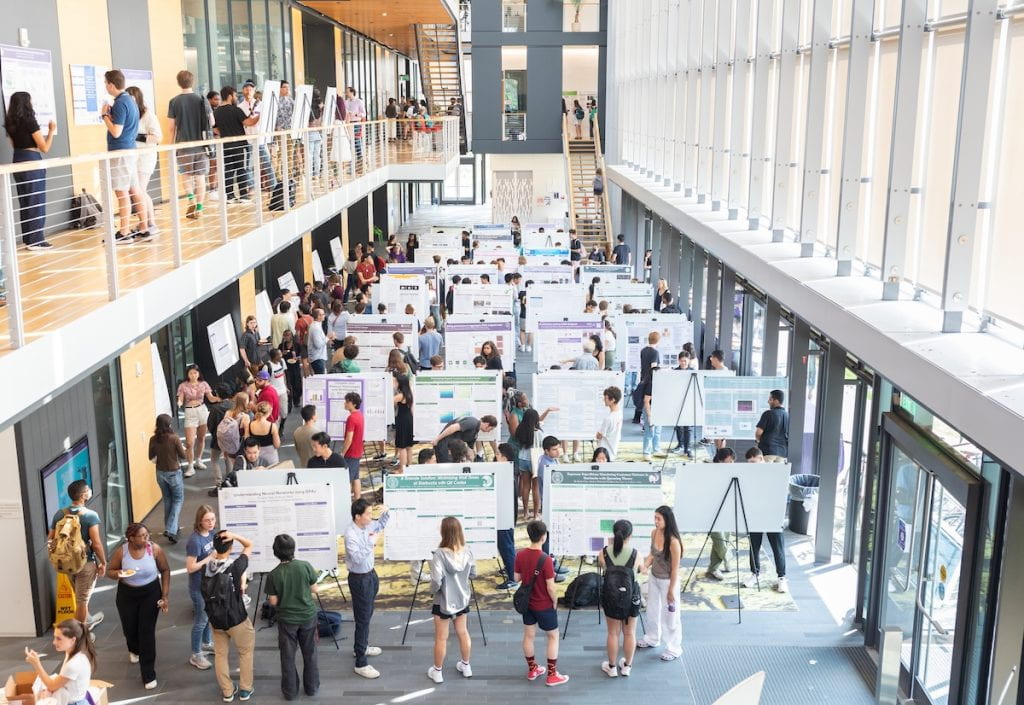 Science Center lobby filled with students presenting their research posters