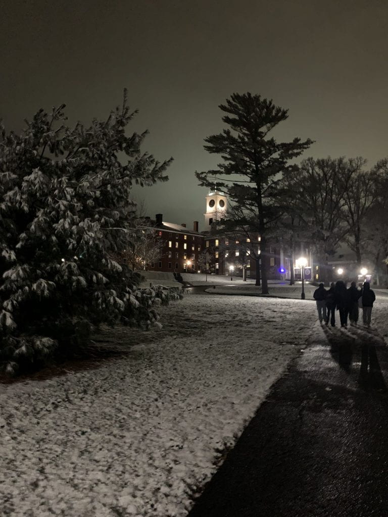 The first year quad covered in snow at night.